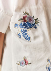 A Model Wearing White Organic Cotton Wild Ocean Heart organic cotton shirt, curated by Only Ethikal